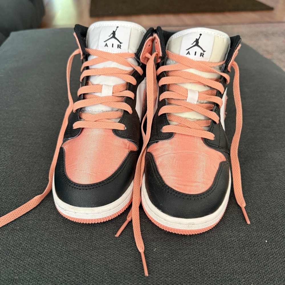 Jordan 1s Mids Nike Black and Pink Sneakers with Classic Silhouette